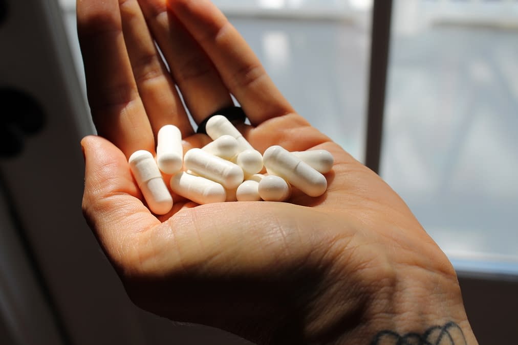 magnesium pills in hand
